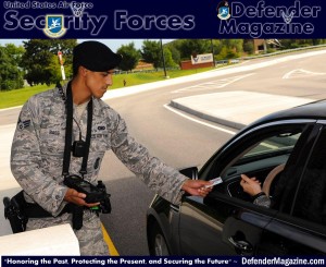 U.S. Air Force Senior Airman Justin Bass, 633rd Security Forces Squadron officer, returns a Common Access Card after scanning it at Langley Air Force Base, Va., July 29, 2014. Due to incompatibility with the Defense Biometric Identification System, retirees with identification cards created before 2003 should visit the Military Personnel Section prior to Jan. 1, 2015, to attain an up-to-date ID card; and contractors with locally-generated badges must visit the VCC for their new IDs. (U.S. Air Force photo by Senior Airman Austin Harvill/Released)